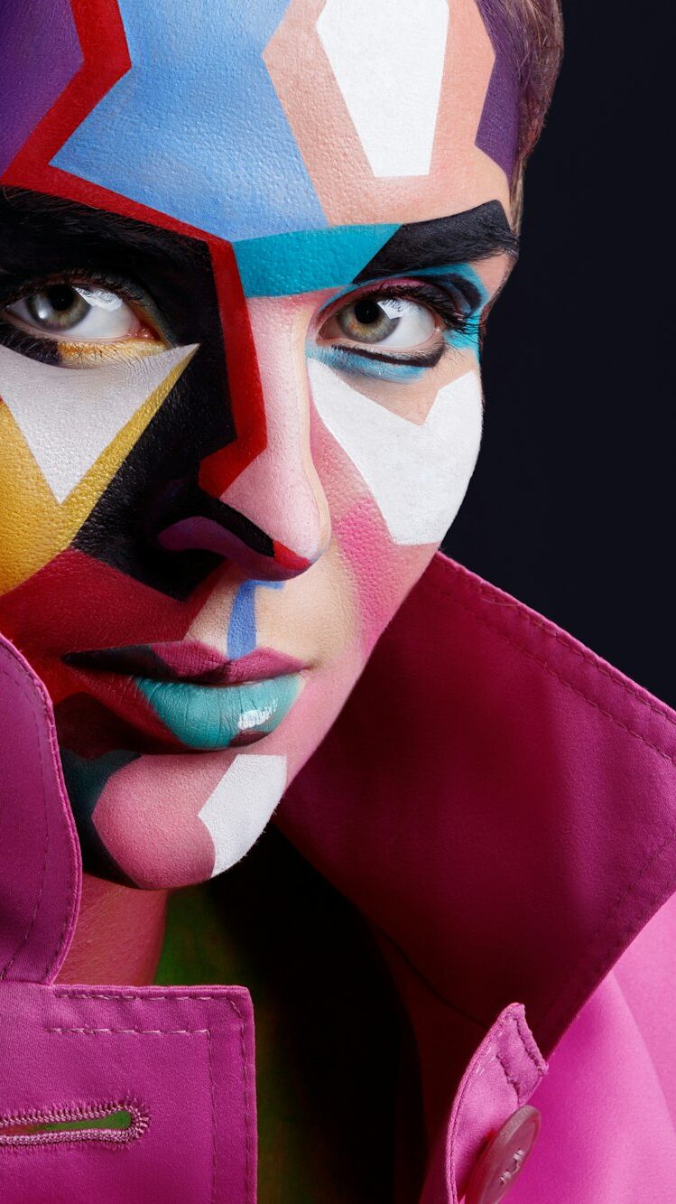 Model with a creative pop art makeup on her face.